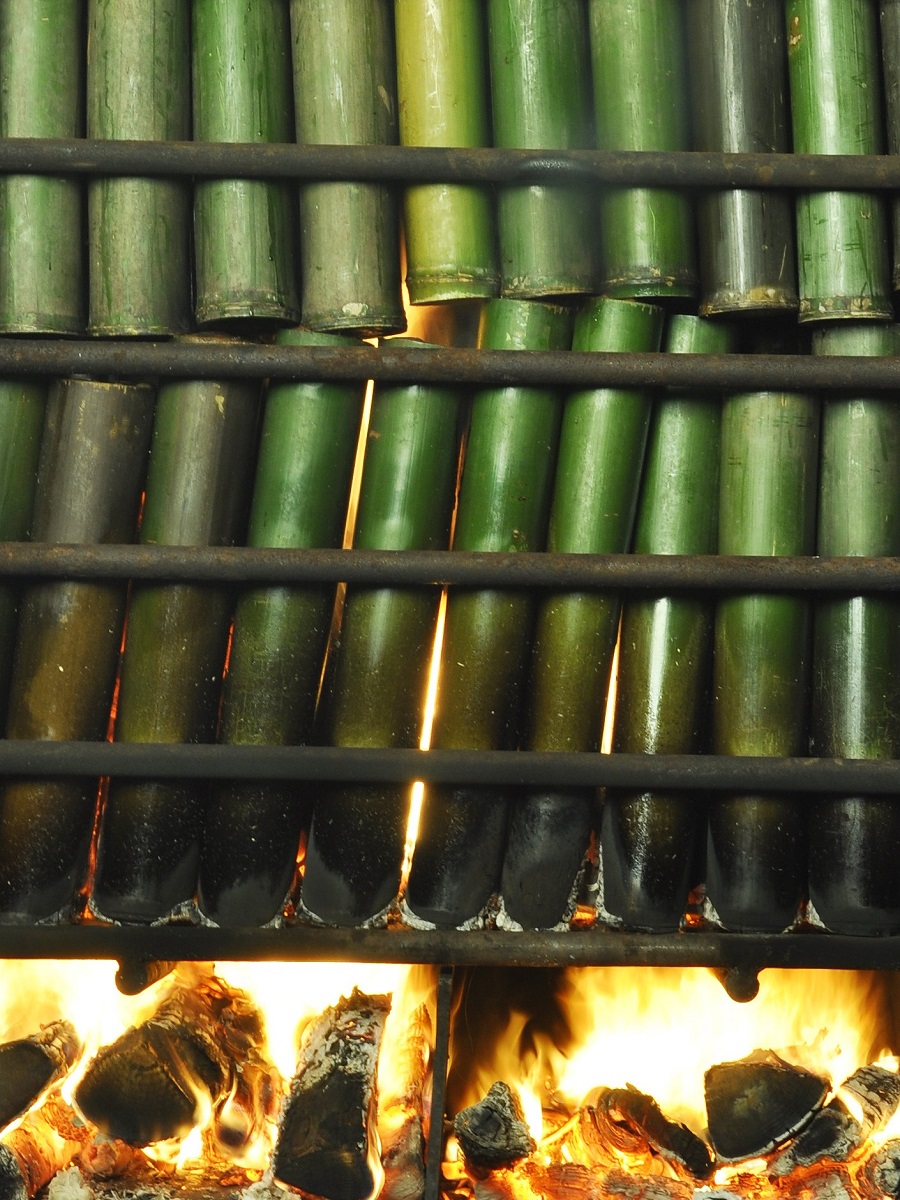 Bamboo filled with salt is burned for the first time in the process of becoming bamboo salt.