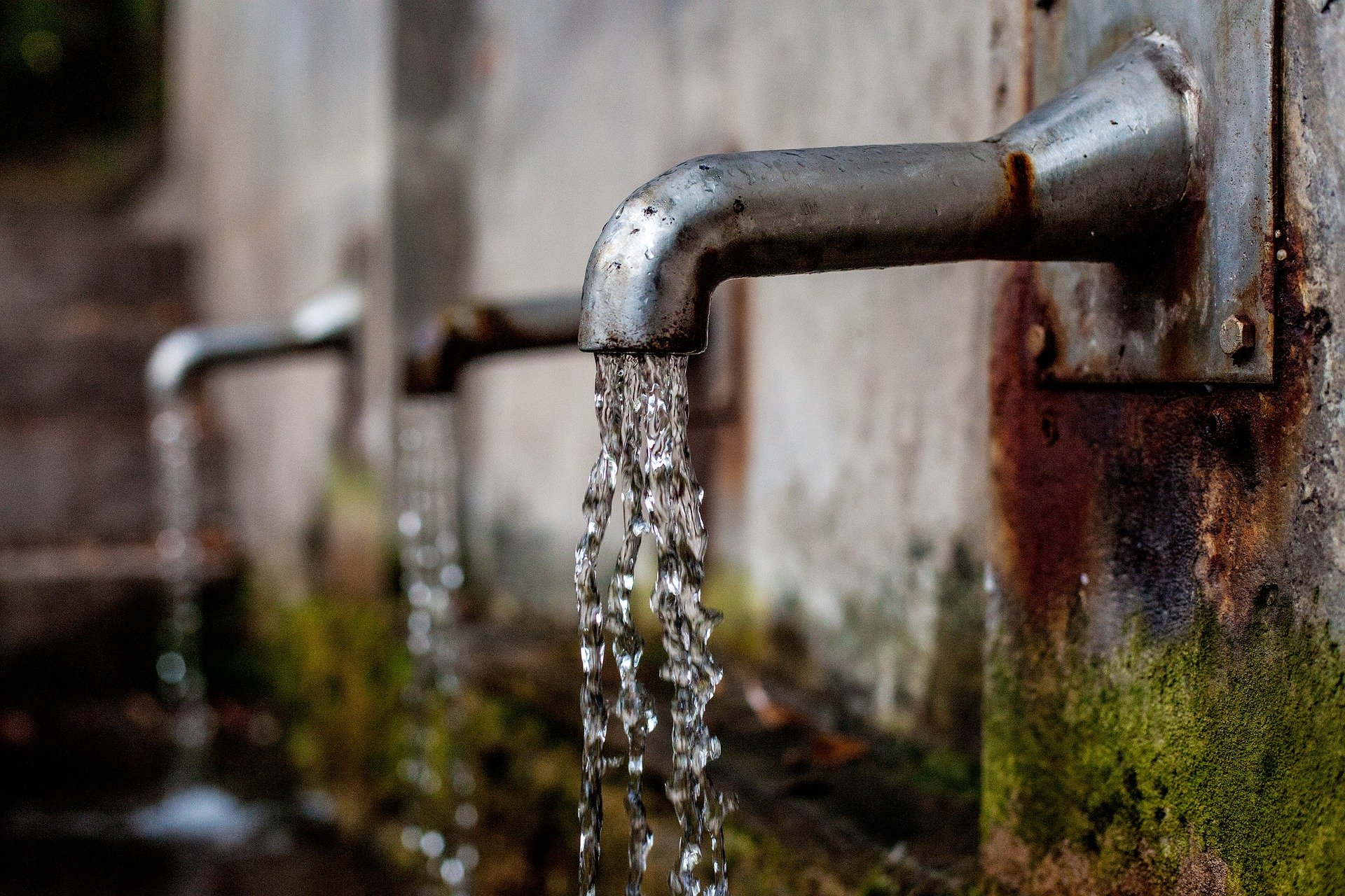 water flows from tap with dirty substances that are harmful to us