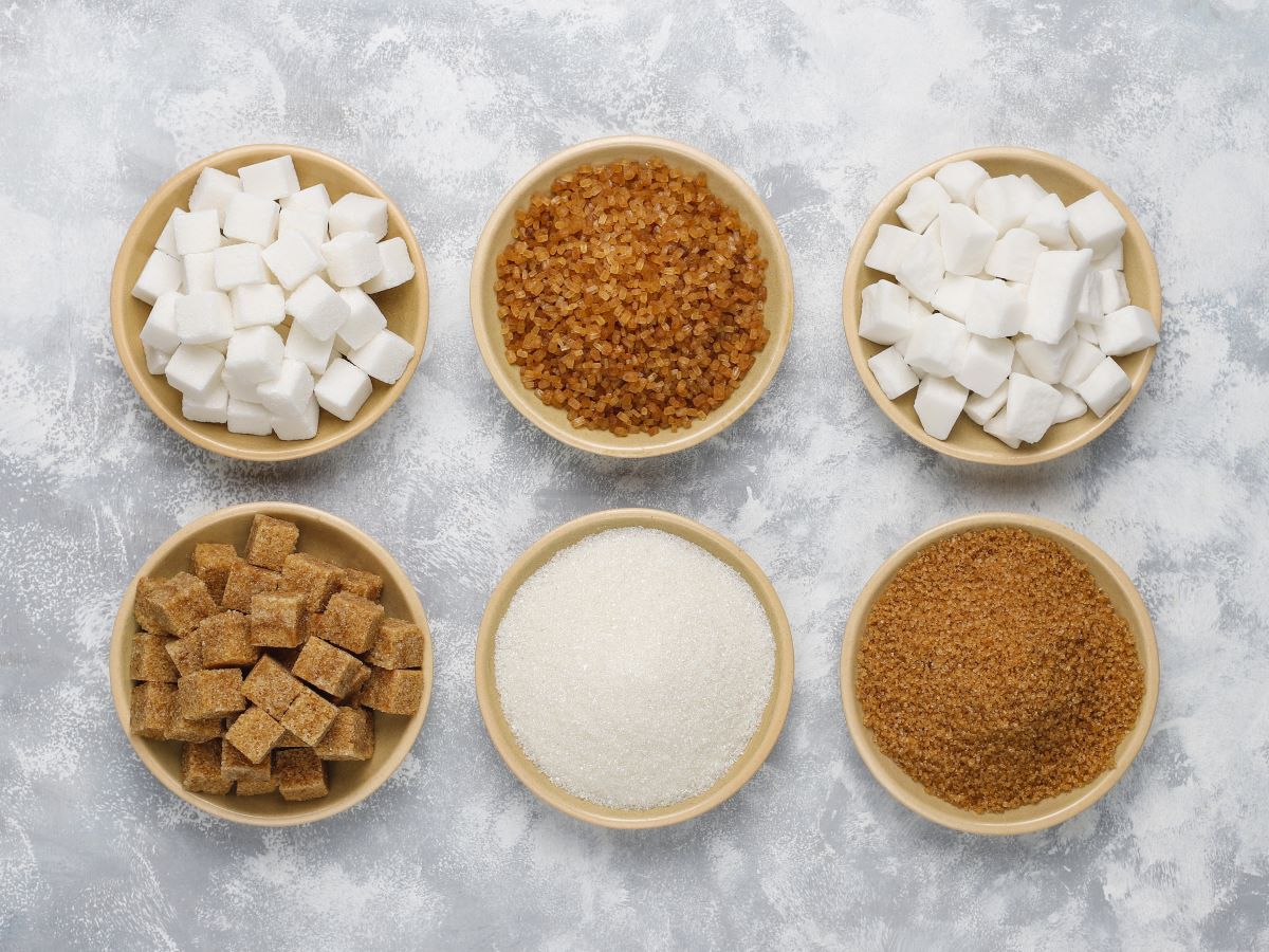 six jars of refined sugars and jar of date sugar